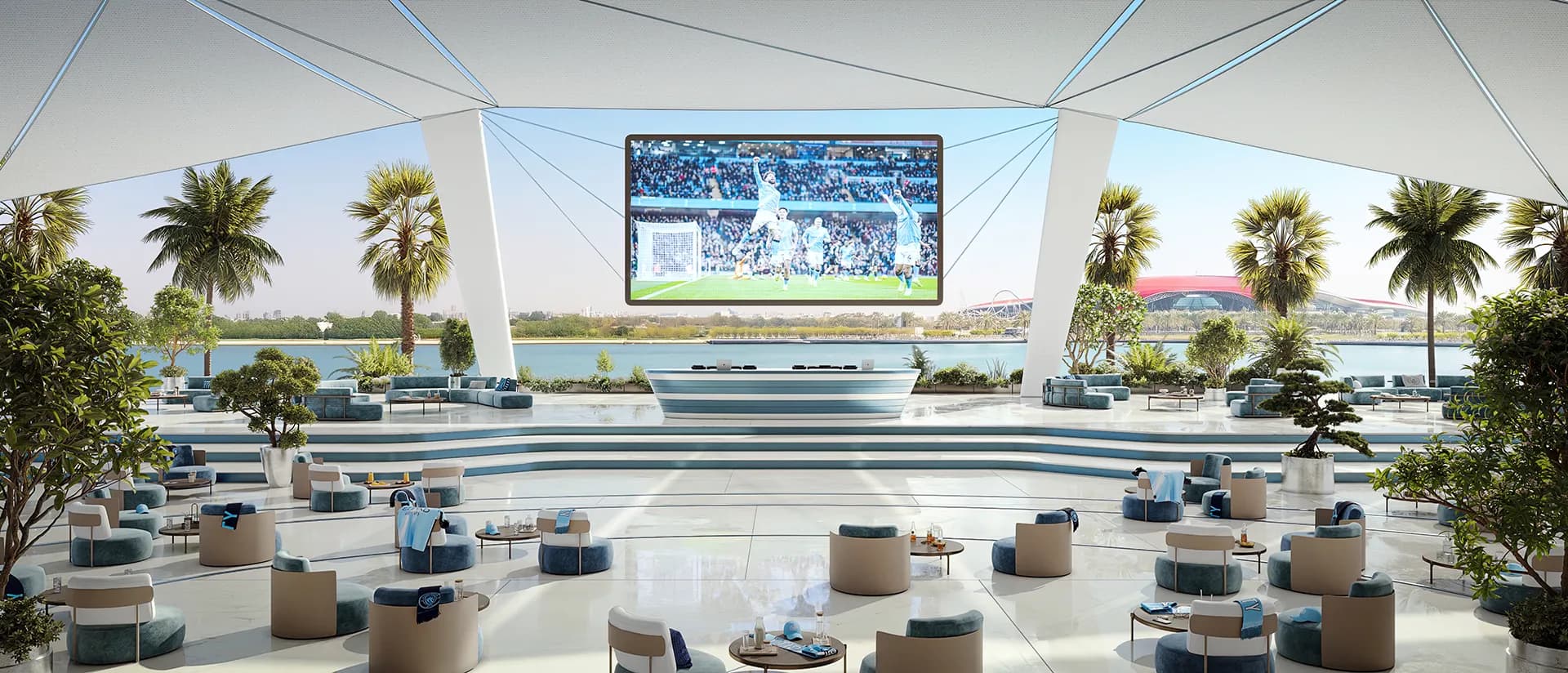 The Match Day Terrace at Manchester City Yas Residences — open-air seating and a screen over the Yas Canal
